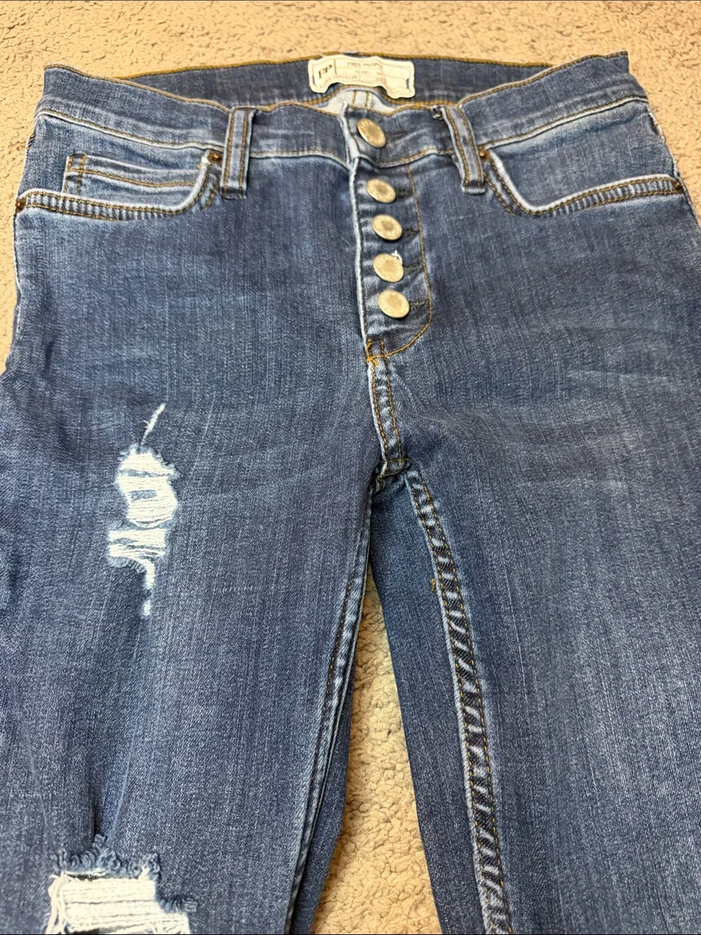 Free People indigo denim jeans with gold stitching
